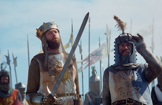 Medieval knights in armor during a historical reenactment or event.