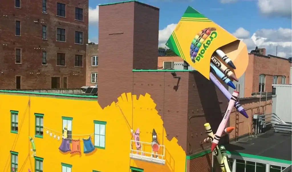 Crayola Experience building in Easton, Pennsylvania, featuring a giant box of crayons on the bright yellow exterior.