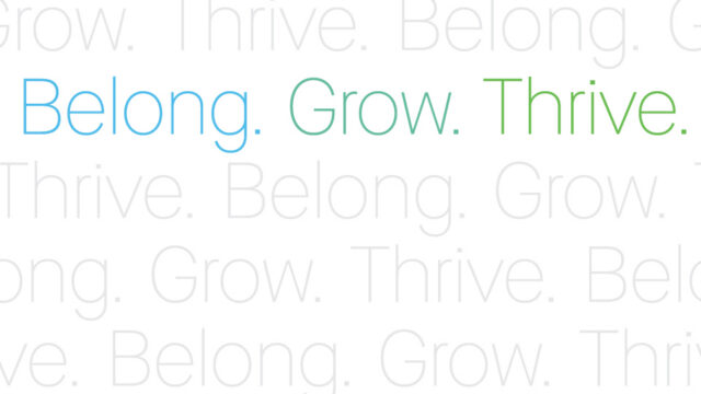 Inspirational quote with words Belong, Grow, Thrive in colorful text on a white background, emphasizing personal growth and community belonging.