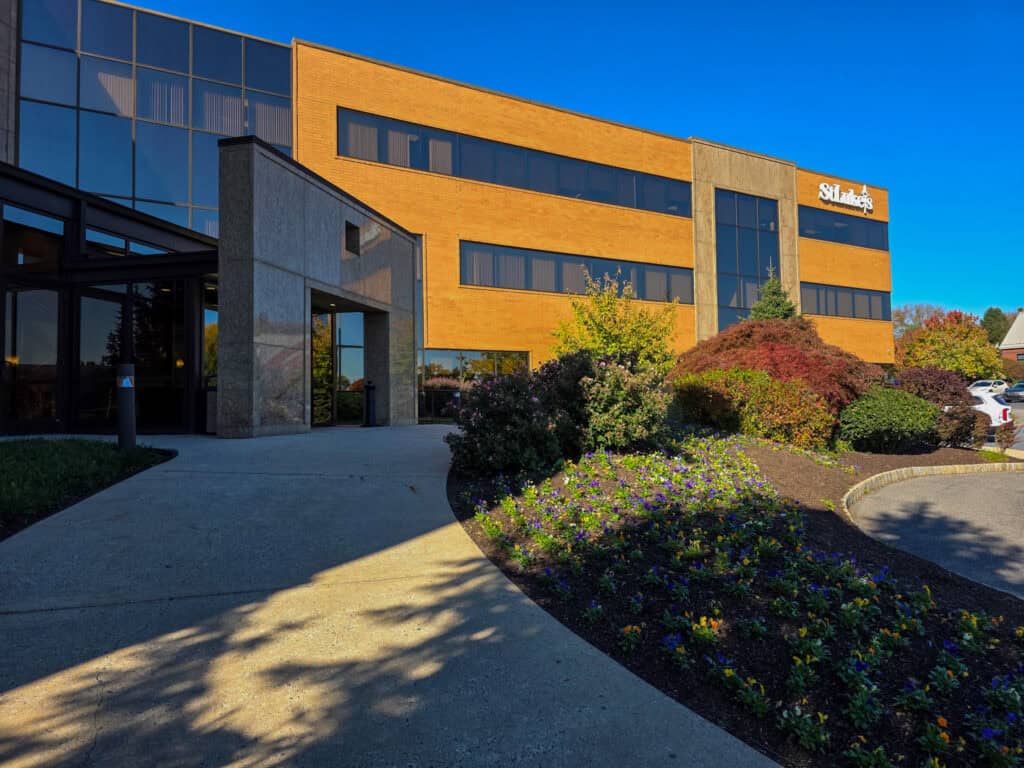 Modern medical office building with landscaped entrance, part of St. Luke's Primary Care in Easton, featuring large windows and a welcoming exterior.