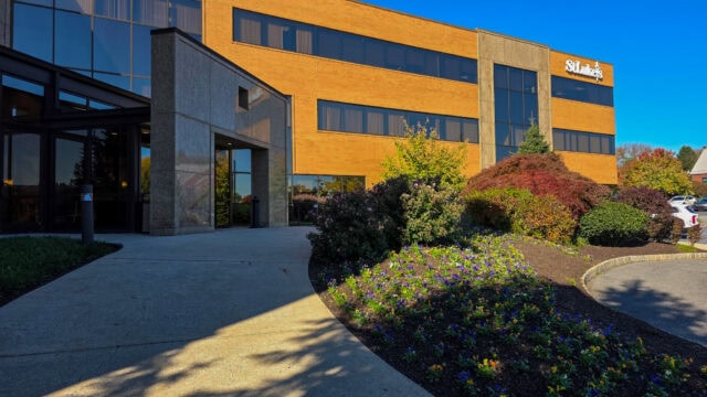 Modern medical office building with landscaped entrance, part of St. Luke's Primary Care in Easton, featuring large windows and a welcoming exterior.